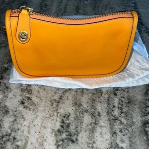Yellow Orange coach swinger purse